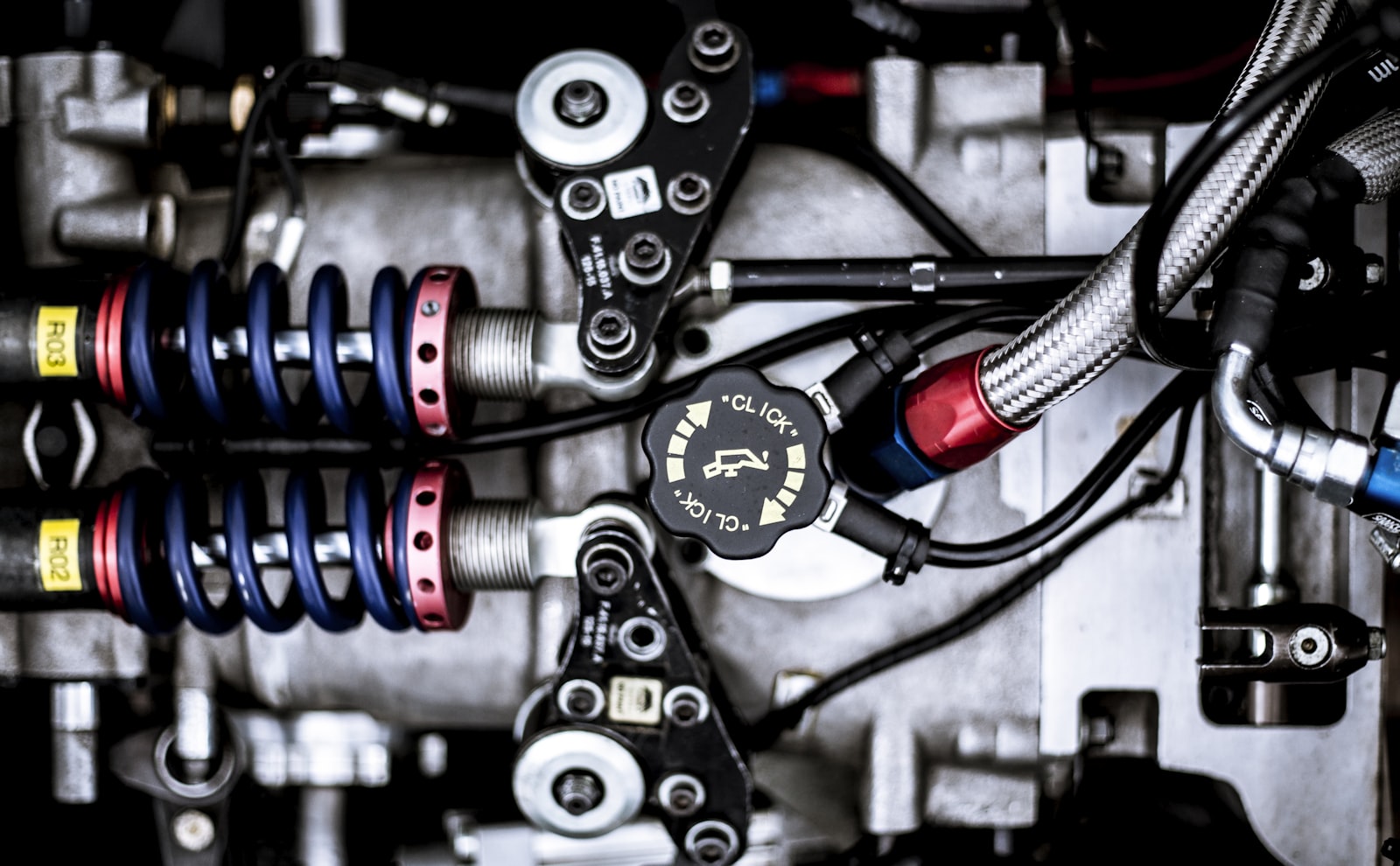 Suspension springs and linkages inside a machine assembly